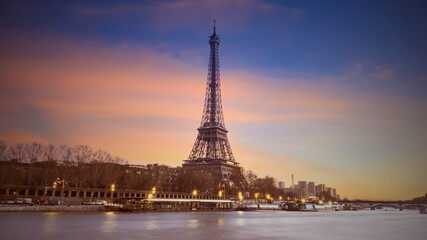 Eiffel tower in Paris, France with Scenic panorama of the river Seine under the twilight skyline