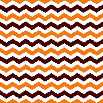 Halloween seamless zigzag pattern, vector illustration. Chevron zigzag pattern with orange and brown lines. Halloween chevron geometric background with rough lines