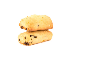 Freshly baked homemade cookies with raisins on another cookie isolated on a white background.