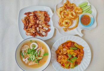 Traditional Roasted streaky pork, Tom Yum kung, Fried Calamari and Sweet and Sour Chicken, manu set for dinner