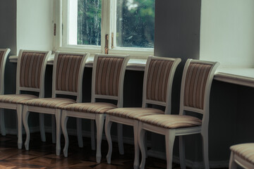 Close up of chairs in room. Beautiful seats in hall for festive events.