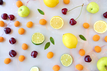 Bright tasty fruits and berries on the table. Healthy nutrition, summertime concept. Colorfull backdrop