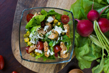 Homemade chicken salad in a glass bowl.