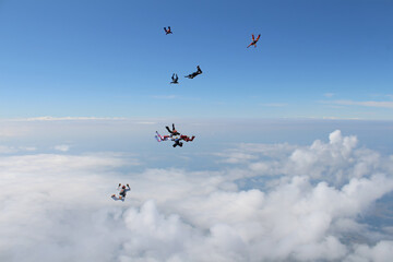 A group of skydivers is in the sky.