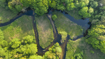 Drone shot of natual river during summer with canoeing peoples