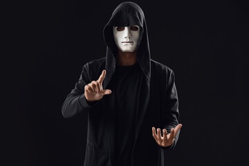 Professional hacker using virtual screen on dark background
