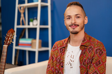 Close-up portrait of a young stylish man with dreadlocks