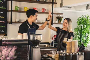 Happy young man and woman developing own coffee business.