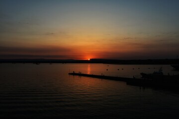 Fototapeta na wymiar Sunset on the sea. Taormina, Sicily, Italy.