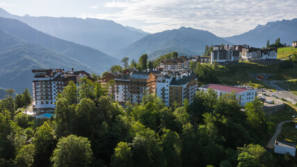 Rosa Khutor plateau, buildings, slopes and chair lifts. Aerial view at summer. Russia, Sochi, Krasnaya Polyana