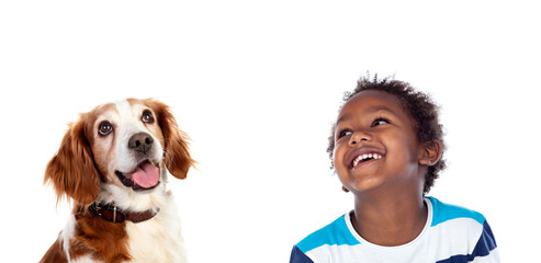Afroamerican child with his dog looking up