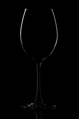 Silhouette of a glass on a black background.