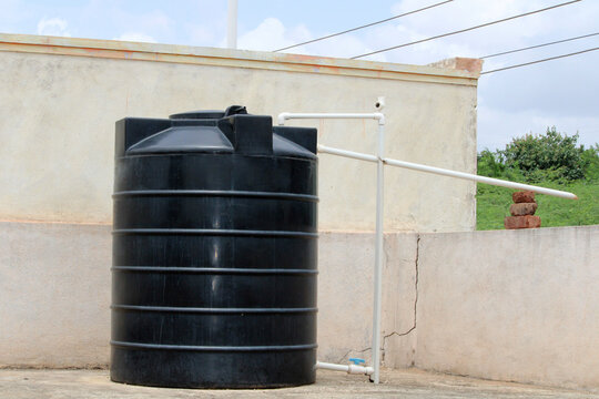 Plastic Water Tank is Fixed on Top of the Village House, Bagalkot, Karnataka.