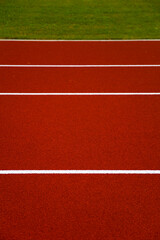 Red stadium running track closeup