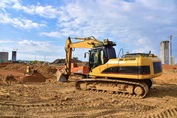 Excavator dozer on eartwork working at construction site.