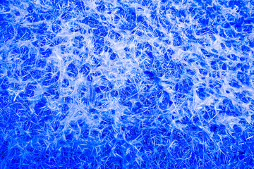 Abstract vivid blue, aqua and white textured background.