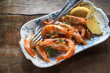 Seafood appetizer of spicy whole grilled prawns - obrazy, fototapety, plakaty