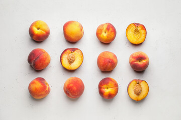 Ripe peaches on light background