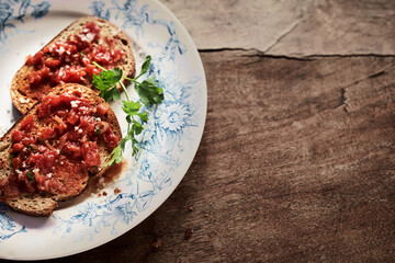 Spanish tapas with tomato and chili topping