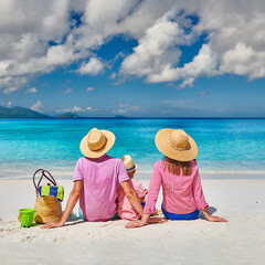 Family with three year old boy on beach. Seychelles, Mahe.