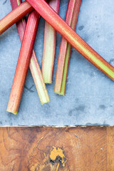 fresh rhubarb on a slate chopping board