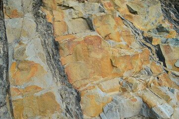 Rock layers - a colorful formations of rocks stacked over the hundreds of years. Interesting background with fascinating texture.