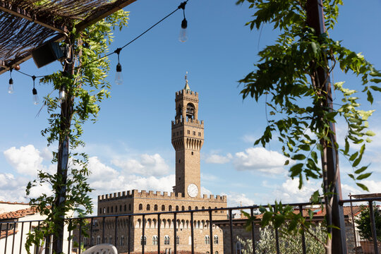 Old building with tower behind terrace