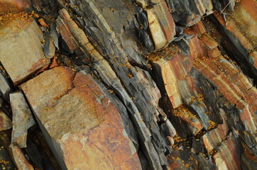 Rock layers - a colorful formations of rocks stacked over the hundreds of years. Interesting background with fascinating texture.