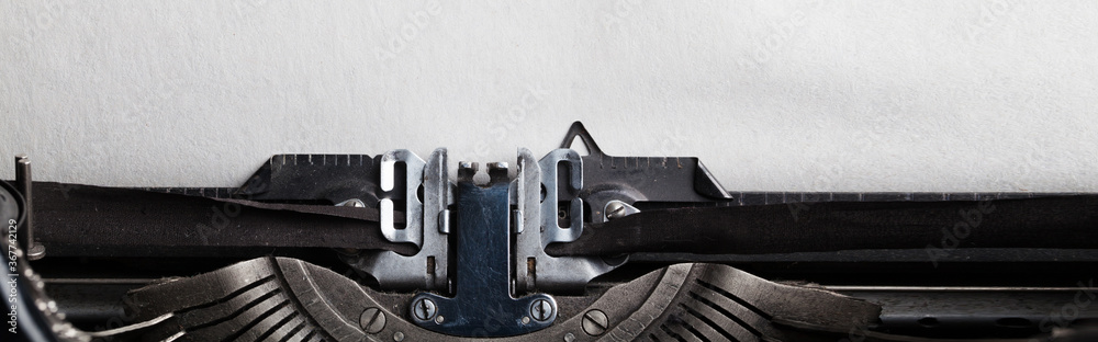 Fototapete empty sheet of a paper for your text inserted into a typewriter. website header or banner