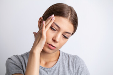 A young woman has a severe headache