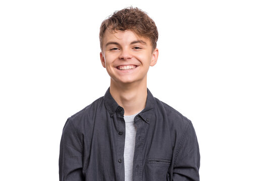 Portrait of smiling teen boy in black shirt. Photo of adorable young happy boy looking at camera, isolated on white background.