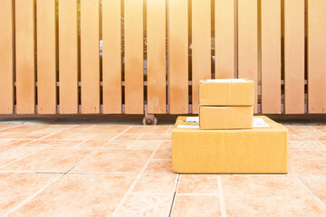  The goods package and sent to receiver at home,Delivery man holding boxes person who sent the package box to the recipient to arrive at home