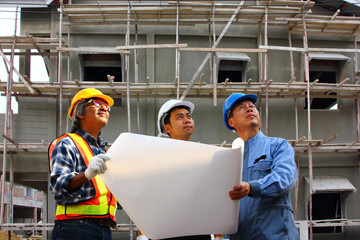 group of engineers standing in front of the project  inspection  the detail of the building
