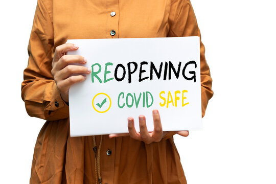 Closeup Woman Holding A Notice Reopening Covid Safe