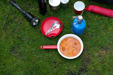 Naklejka premium Camping tools on the grass