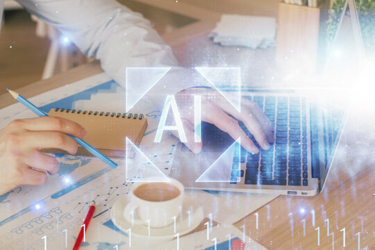 Multi exposure of data internet theme hologram with man working on computer on background. Concept of innovation.