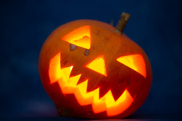 Scary halloween pumpkin for holiday on blue background