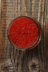 Delicious red caviar in a glass jar