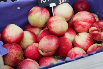 Juicy nectarines on the market close up