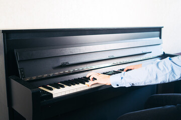 Classic piano key with musician hands playing