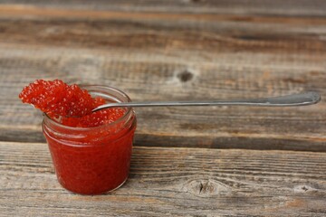 Delicious red caviar in a glass jar