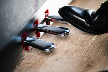 shoes piano pedals with wood floor