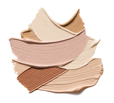 Makeup foundation swatches isolated on white background. Brown color correcting cream strokes of various shades. Skin tone concealer smear smudge