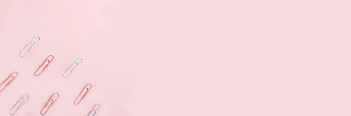 School stationery and supplies on a pink background with space for caption. Back to school, homeschool creative workspace. Minimalistic set of colorful stationery. Flat lay