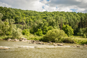 Beautiful summer landscape of green nature. Forest, river and hills