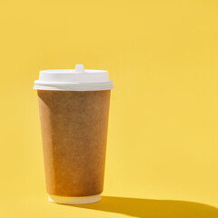 Blank craft take away big paper cup for coffee, dark shadow.