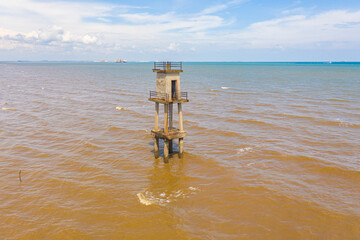 Observation tower in the sea of the west coast of Malaysia in the strait of Malacca. An aerial view during low tide. Shoreline of Sepang near the Avani Sepang Goldcoast Resort
