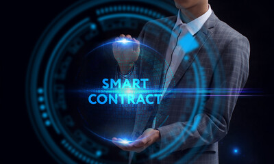 Business, Technology, Internet and network concept. Young businessman working on a virtual screen of the future and sees the inscription: Smart contract