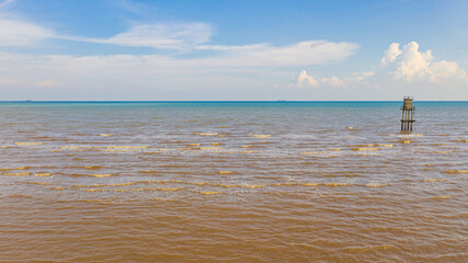 Observation tower in the sea of the west coast of Malaysia in the strait of Malacca. An aerial view during low tide. Shoreline of Sepang near the Avani Sepang Goldcoast Resort