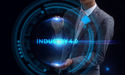 Business, Technology, Internet and network concept. Young businessman working on a virtual screen of the future and sees the inscription: Industry 4.0